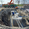 Drie regenwaterputten van 10m3 met onderlinge koppeling, ankerpennen en bekisting